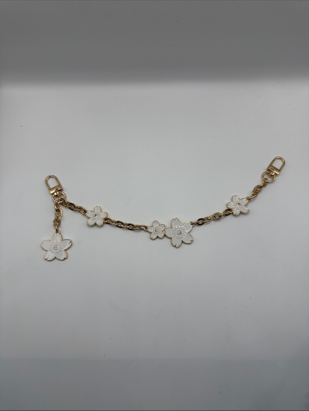 169. Gold Bag Chain with White Flower Charms 11”